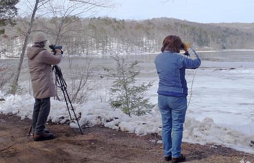 Birders scan Salmon R cove